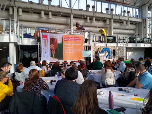 Rapid rehousing seminar attendees in Cardiff listen to the introduction from the event chair