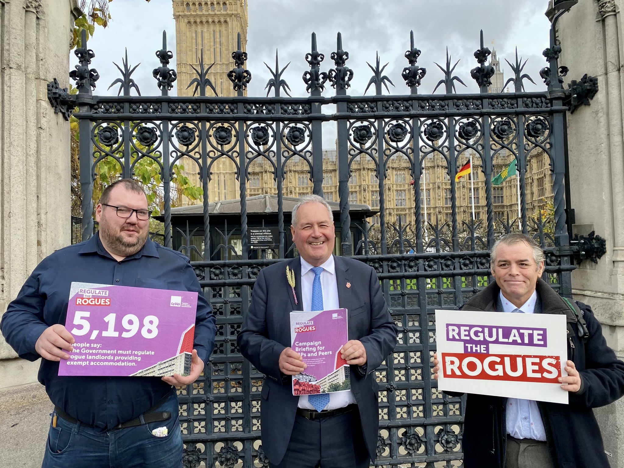 Bob Blackman MP and Crisis members Ian and Wayne outside the Houses of Parliament