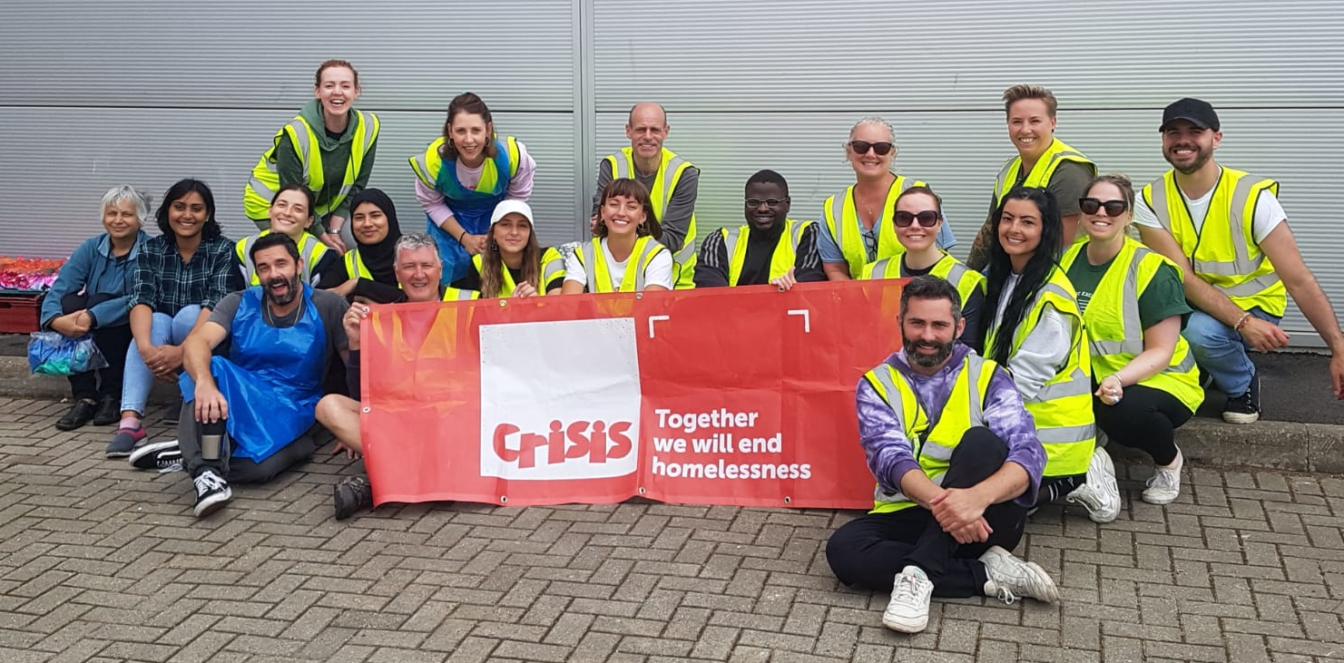 Group With Crisis Banner Tie Dye Team Volunteering Day June 2023