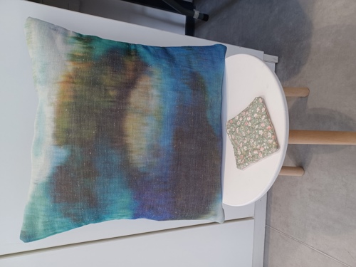 Cushion with tie dye pattern on a table