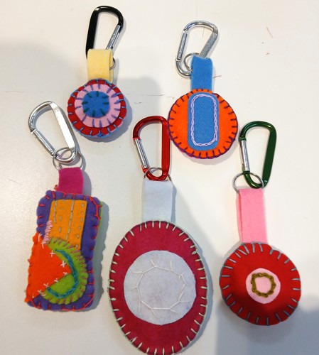 Five small colourful keyrings made out of felt